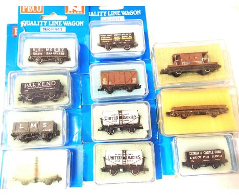 Eleven Peco N gauge wagons, opens, tanker, cattle, brake etc, boxed. P&P Group 1 (£14+VAT for the first lot and £1+VAT for su