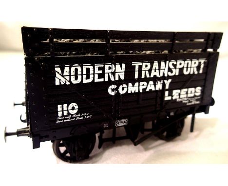O gauge Skytrex 8 plank wagon, with Coke rails, Modern Transport Co, missing 1x buffer, unboxed. P&amp;P Group 1 (£14+VAT for