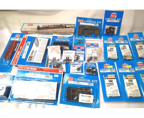 Selection of Peco N gauge accessories; tunnel mouths, gates, switch consoles platforms, bridge sides etc. new in packets. P&a