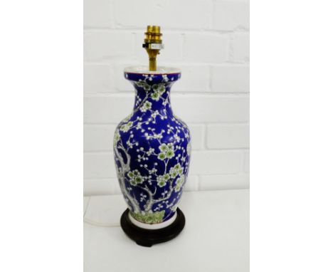 Prunus patterned ceramic table lamp base on hardwood stand