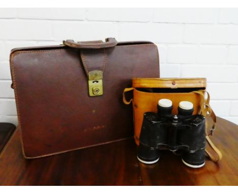 Vintage brown leather briefcase together with a pair of binoculars in a tan leather case, (2) 