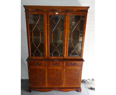 Cherrywood bookcase with glazed doors to top over three short drawers and three cupboards to the base, on bracket supports, 1