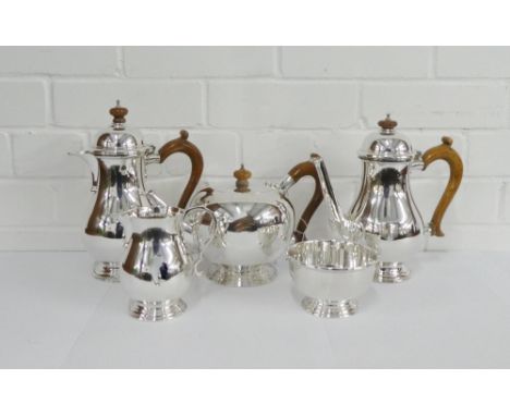 20th century five piece silver teaset comprising a bullet shaped teapot, 18th century style coffee pot and hot water pot each