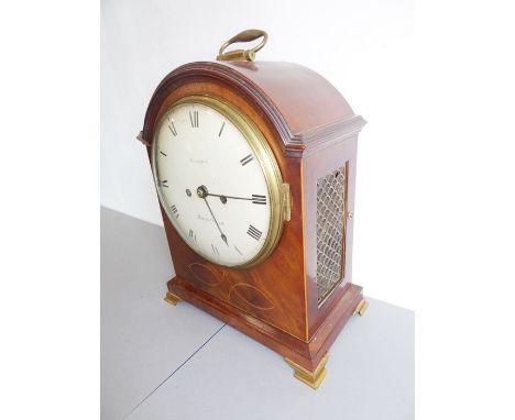 A 19th century mahogany and boxwood-strung eight-day bracket clock; the oval hinged gilt-metal handle above a 20cm dial with 