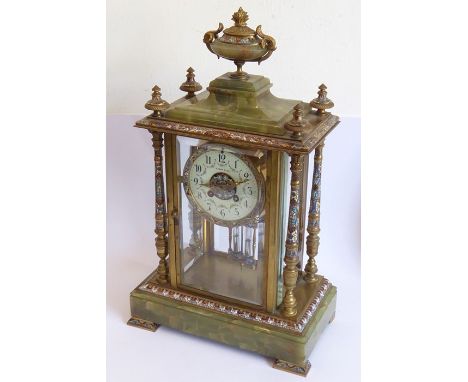 A 19th century banded onyx and&nbsp;champlevé enamel mounted eight-day mantle clock; the central gilt-metal-mounted and champ