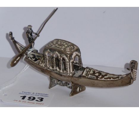 An unusual heavy Continental silver model of a gondola on stand; the central canopy with arches and hinges lifting back to re