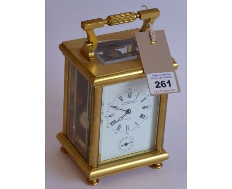 A very fine 19th century gilt-metal-cased and glass-sided carriage clock; the swing carrying handle above a white enamel dial