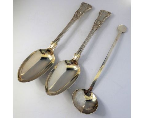 A pair of heavy mid 19th century hallmarked silver serving spoons; double-struck in the King's pattern, maker's mark R.W., as