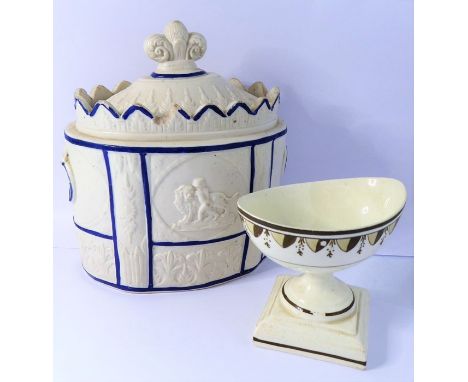 A late 18th century oval and salt-glaze lidded sucrier decorated in relief; the finial as a fleur-de-lys and the two side pan