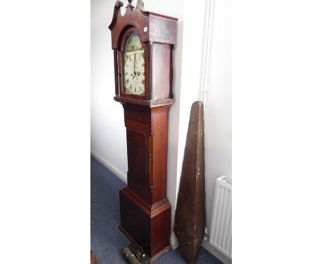 An early 19th century mahogany and boxwood-strung eight-day longcase clock; the broken swan-neck pediment centrally surmounte