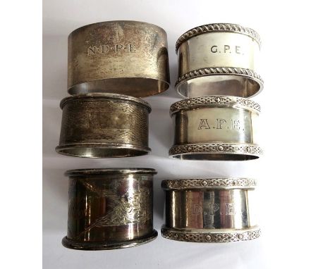 Six hallmarked silver napkin rings: a&nbsp;pair of heavy hallmarked examples with&nbsp;Celtic bands, another of roughly simil