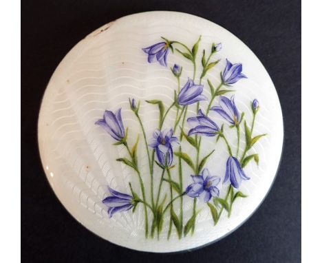An early 20th century white-metal powder compact with mirror; the hinged lid decorated in guilloche enamels with harebells, e