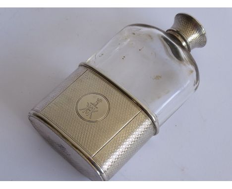 A 19th century transparent glass and silver-mounted hip flask; both the engine-turned screw-top and oval cup engraved with ar