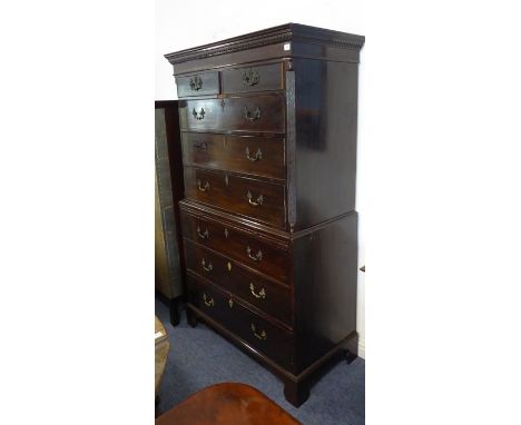 A late 18th century mahogany chest-on-chest; the dentil cornice above two half-width and three graduated full-width oak lined