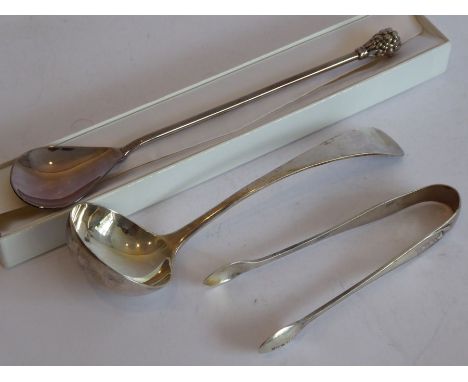 A hallmarked silver ladle, a pair of hallmarked silver sugar tongs and a boxed hallmarked silver handmade spoon with long han