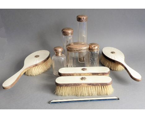 A lady's silver and&nbsp;guilloche enamel dressing table set: two hairbrushes and two clothes brushes. Together with&nbsp;a c