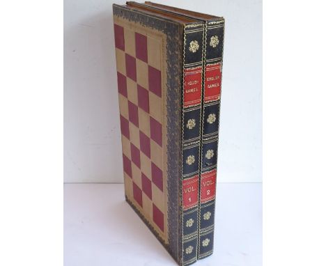A leather-covered late 19th/early 20th century games box modelled as two volumes comprising outer chess/draughts board and in