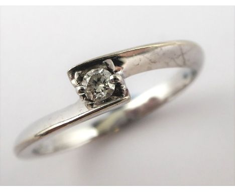 A solitaire diamond ring, the stone set in a white gold ring marked 10K (total weight 1.6g, diamond spreads 0.05cts approx.)C