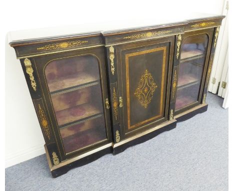 An ebonised breakfront credenza of large proportions; amboyna-banded, marquetry and gilt-metal-mounted,&nbsp;the moulded top 