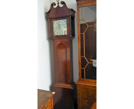 An early 19th century oak and mahogany cased thirty-hour longcase clock; the broken swan-neck pediment surmounted by an open-