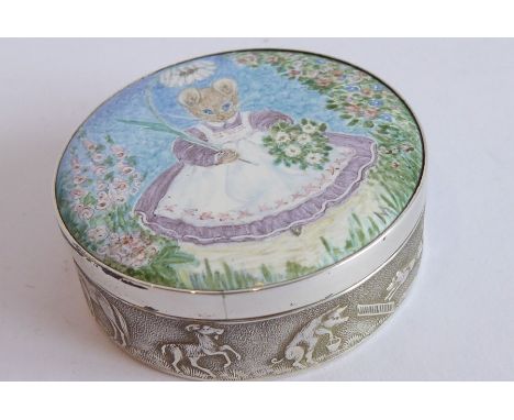 A circular silver and enamel box; the enamel lid depicting Mrs Tittlemouse carrying a parasol and posy of daisies with a bowe