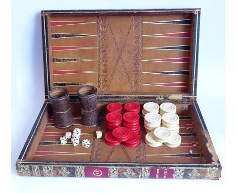 A 19th century leather-bound games board (as two volumes); the folding books opening to reveal inner section for backgammon a