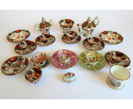 A selection of 19th century miniature cups, saucers, a sugar bowl, teapot, miniature two-handled sucrier etc. (from differing