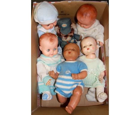 Five vintage dolls.