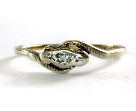 A 9ct yellow gold and platinum (stamped 9ct & plat) three diamond set ring, (P).