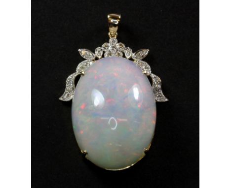 A superb 14ct (stamped 585) yellow gold opal and diamond set pendant, opal approx. 42.59ct.