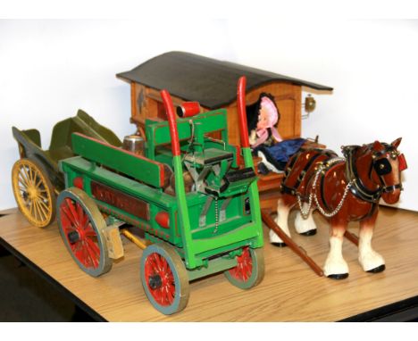 Three wooden model carts and ceramic horse.