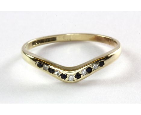 A 9ct yellow gold sapphire and diamond set wishbone ring, (M).