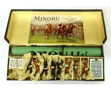 A boxed vintage Minoru race game with eight cast metal horses.