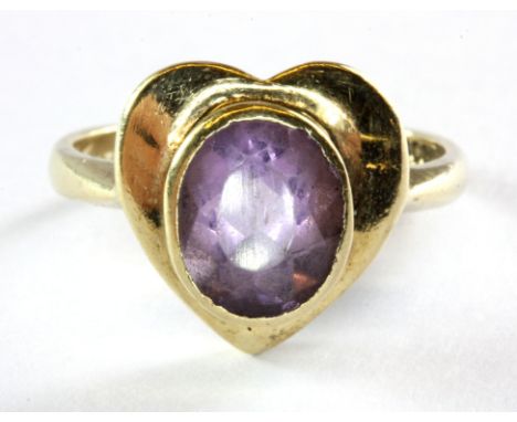 A 9ct yellow gold amethyst set ring, (O.5).