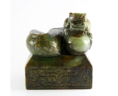 An important Chinese carved and gilt metal overlaid jade seal of a dragon, 8 x 8 x 9cm. Prov. J. Rich collection.