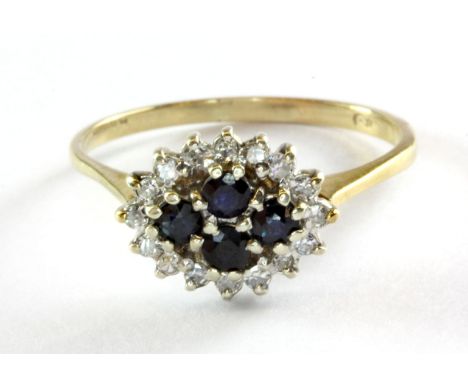 A 9ct (mark worn) yellow gold sapphire and diamond set cluster ring, (Q).