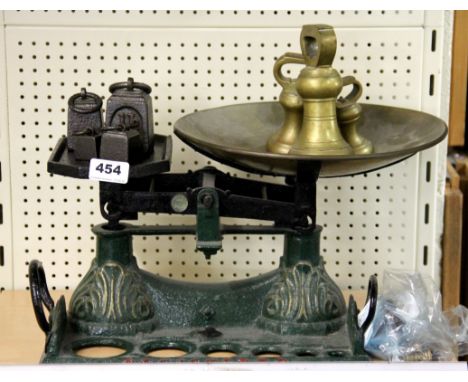 A Victorian cast iron scale and weights, 33 x 22cm.