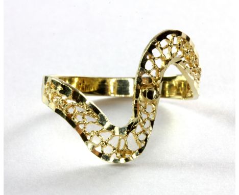 A 14ct (stamped 14k) yellow gold ring with pierced decoration, (O).