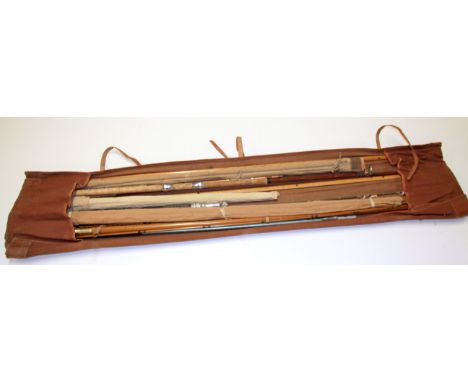 A quantity of vintage fishing rods.