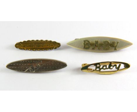 Four vintage baby brooches.