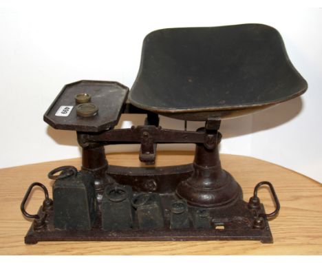 A kitchen scale and weights.
