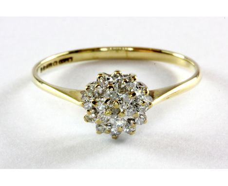 A 9ct yellow gold diamond set cluster ring, (O.5).