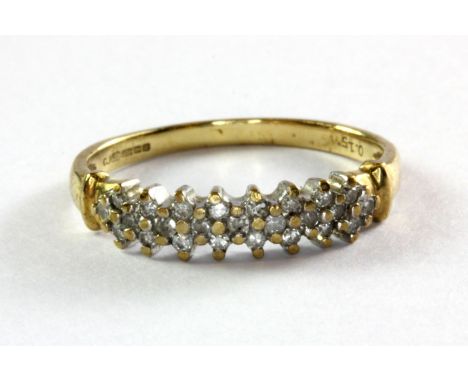 A 9ct yellow gold diamond set half eternity ring, (N).