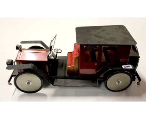 A large handmade metal and wood model of a vintage motor car, L. 58cm, H. 24cm.
