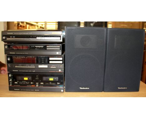 A vintage Technics stereo system with speakers
