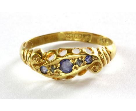 An 18ct yellow gold sapphire and diamond set ring, (J).