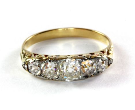 A yellow metal (tested 18ct yellow gold) antique five diamond ring, (N.5).