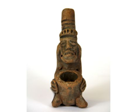 A small South American pottery tobbaco pipe, H. 10cm.