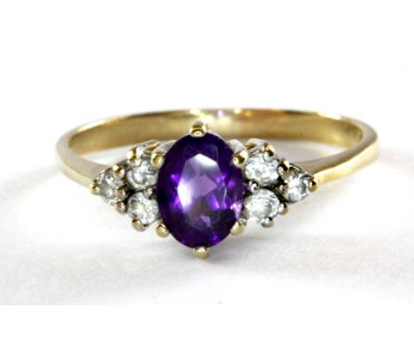 A 9ct yellow gold amethyst and cubic zirconia set ring, (R).