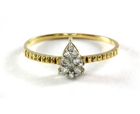 An 18ct (stamped 750) yellow gold and diamond set ring, (N.5).